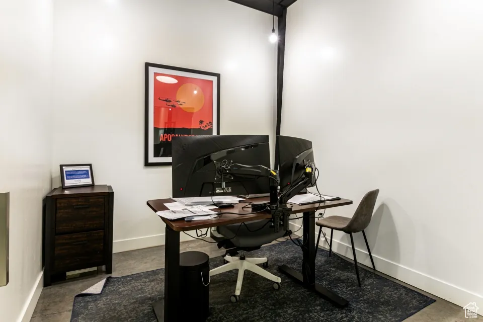 Office space with finished concrete floors and baseboards