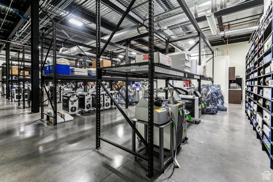 Workout area with a towering ceiling