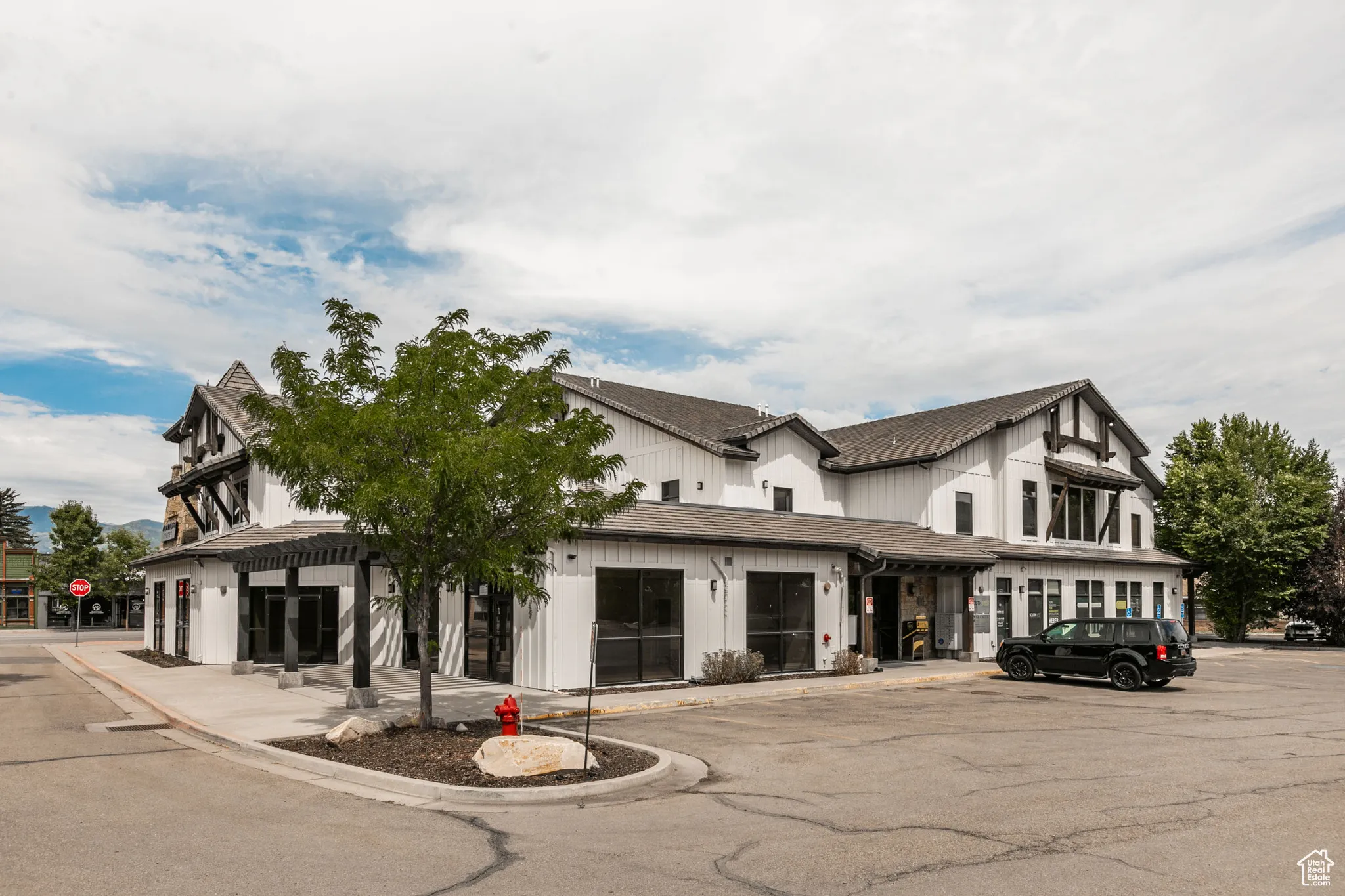 View of property with uncovered parking