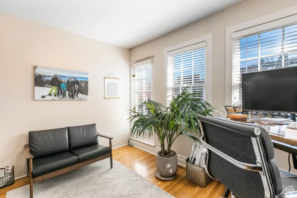 Home office featuring baseboards and wood finished floors