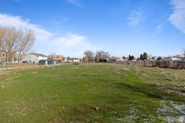 View of yard featuring fence