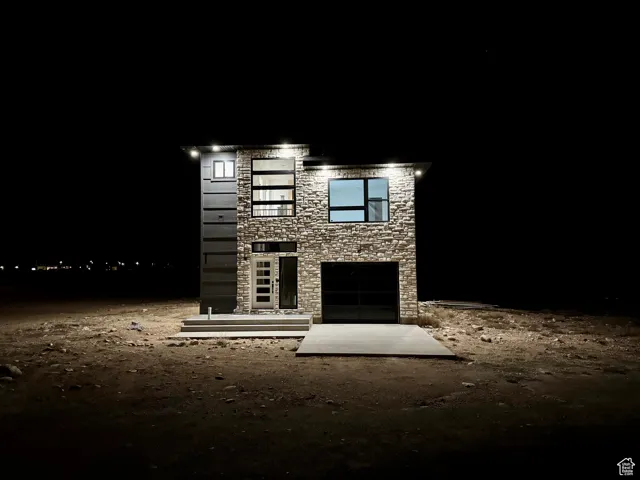 View of front of property with stone siding