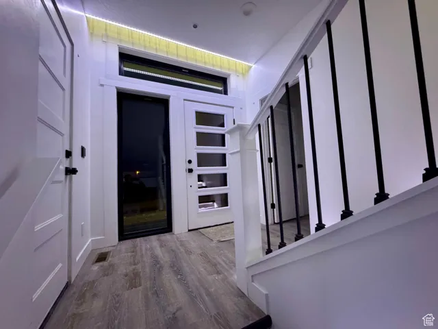 Entryway featuring visible vents and wood finished floors