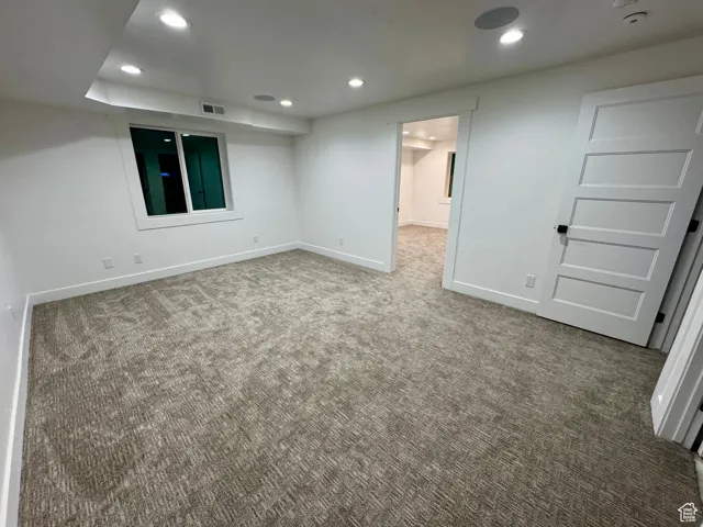 Finished basement featuring recessed lighting, carpet, visible vents, and baseboards
