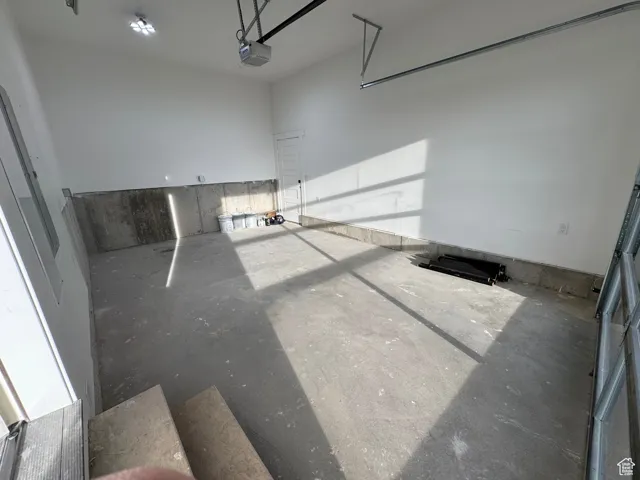 Garage featuring a garage door opener