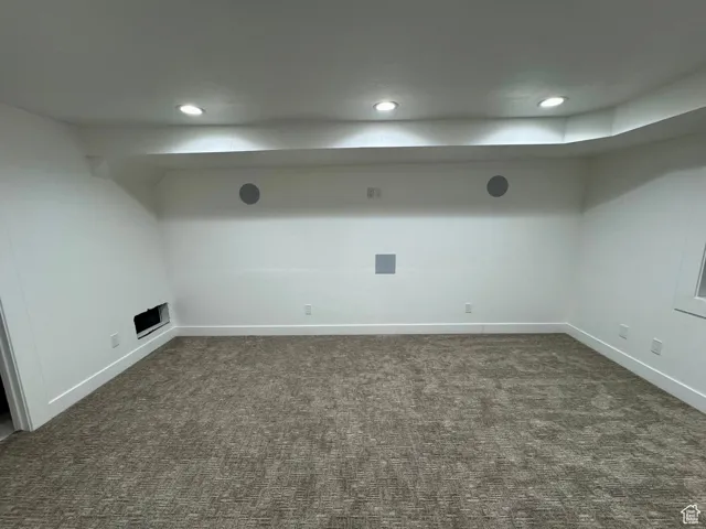 Finished below grade area with recessed lighting, baseboards, and carpet floors