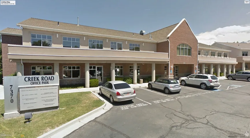 Exterior space featuring uncovered parking