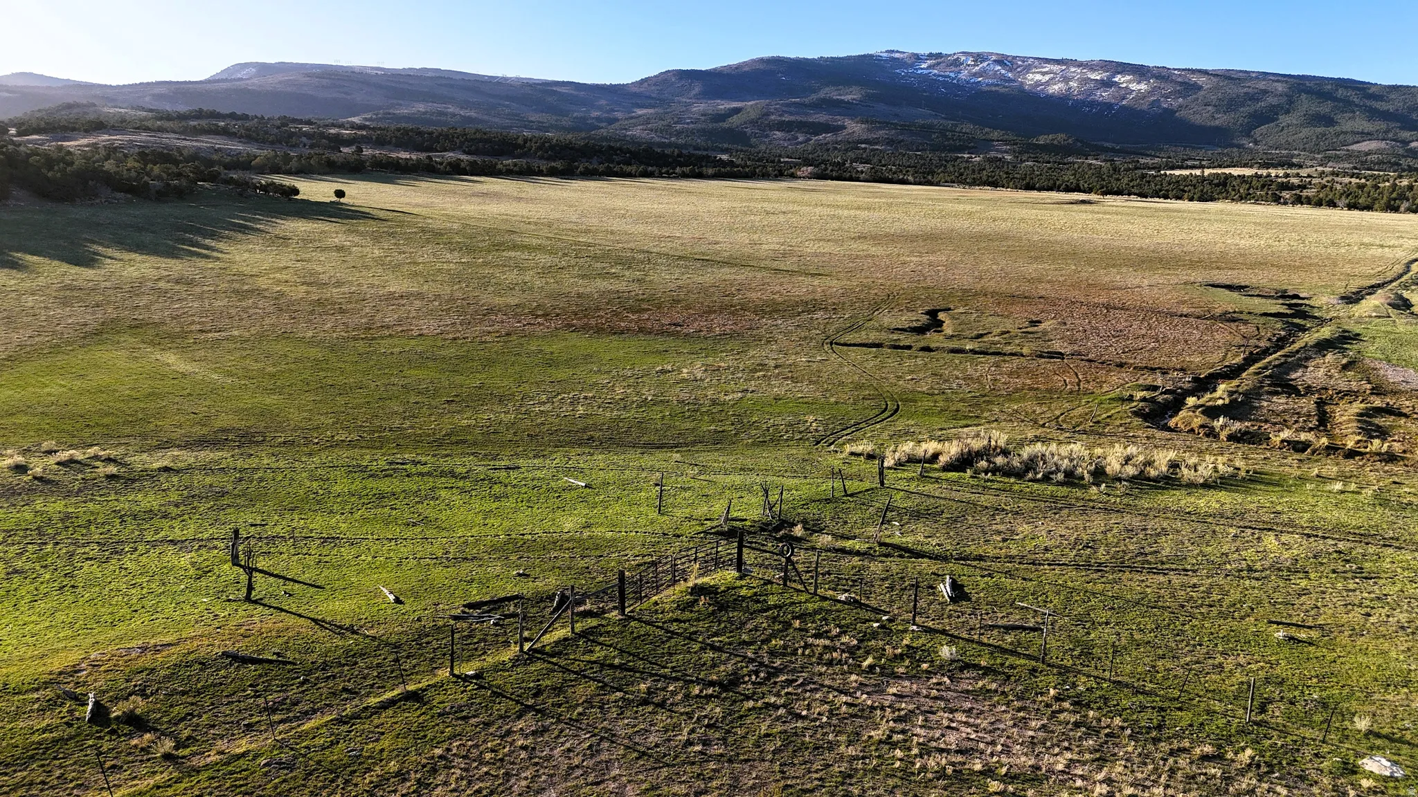 View of mountain background featuring rural landscape