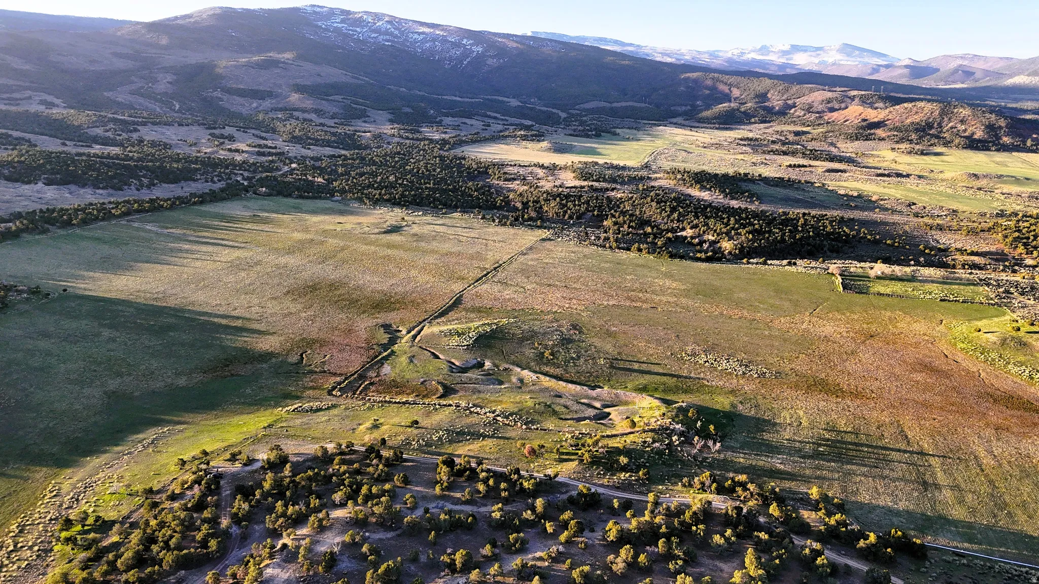 View of property location with rural landscape and mountains