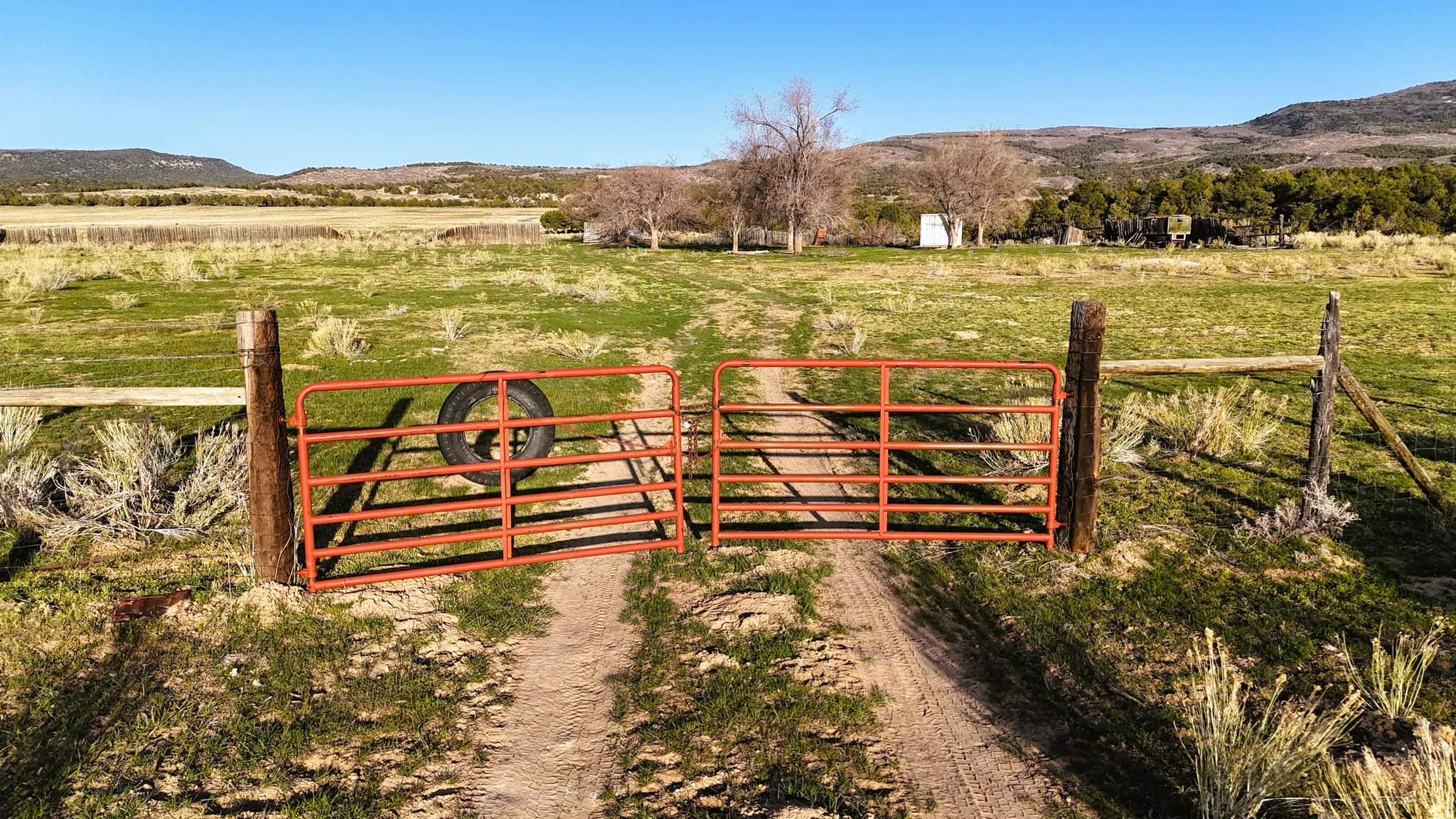 Gate featuring a mountain view and a view of countryside