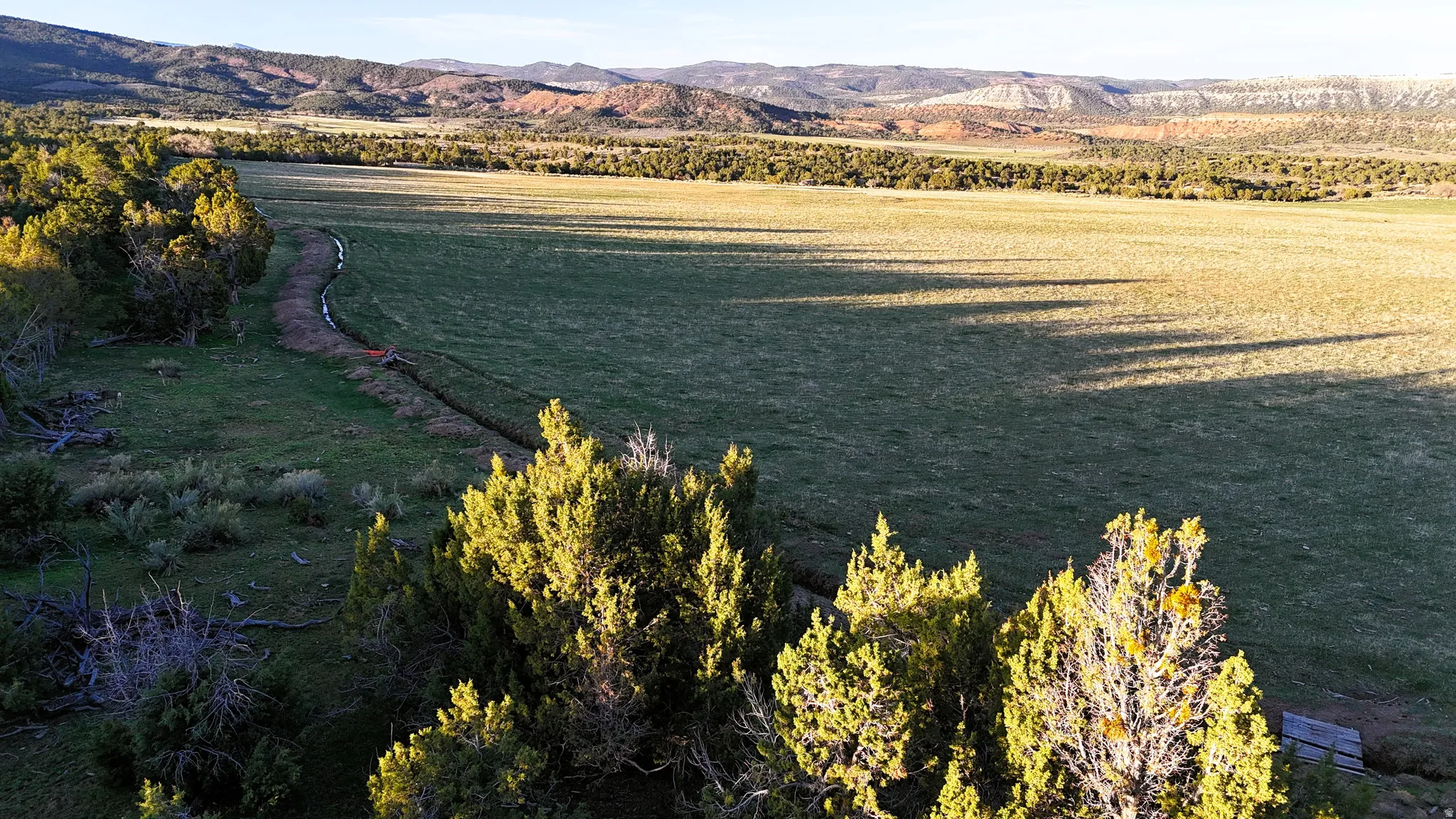 Water view featuring a mountain backdrop and rural landscape