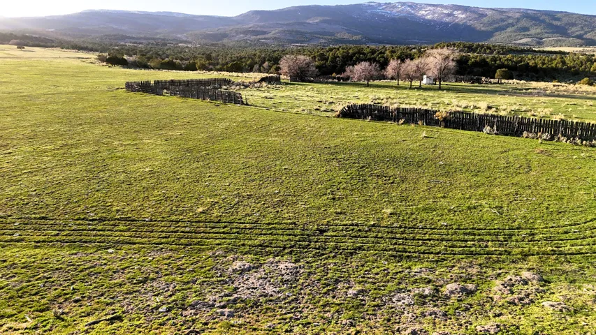 View of mountain backdrop featuring rural landscape