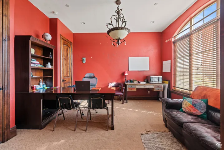 Office space with plenty of natural light and carpet