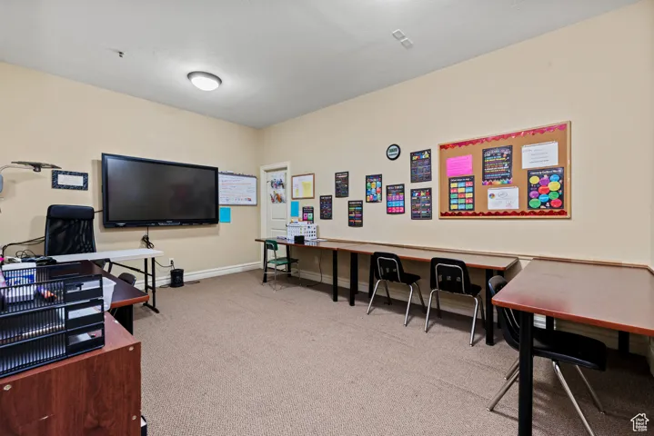 Office area with carpet and baseboards