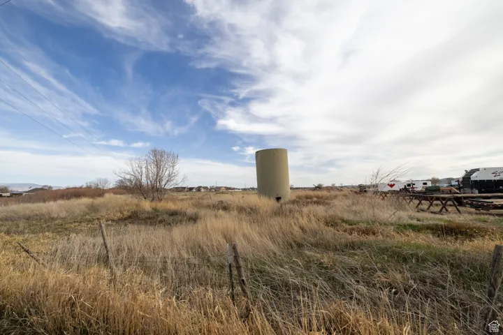 View of yard with a rural view