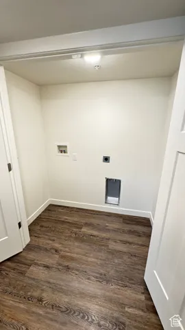 Laundry area featuring electric dryer hookup, baseboards, washer hookup, laundry area, and dark wood finished floors