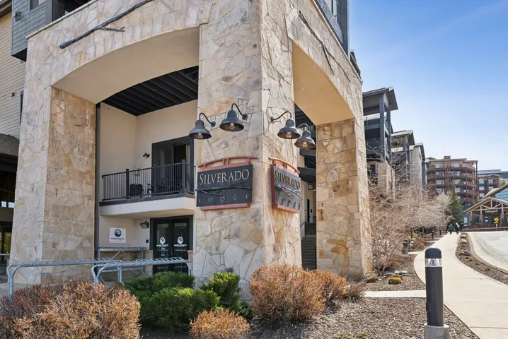 Stone veneer facade with an arched entryway