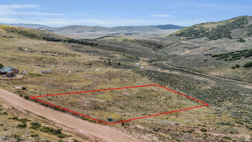 Birds eye view of property with a mountain view and a rural view