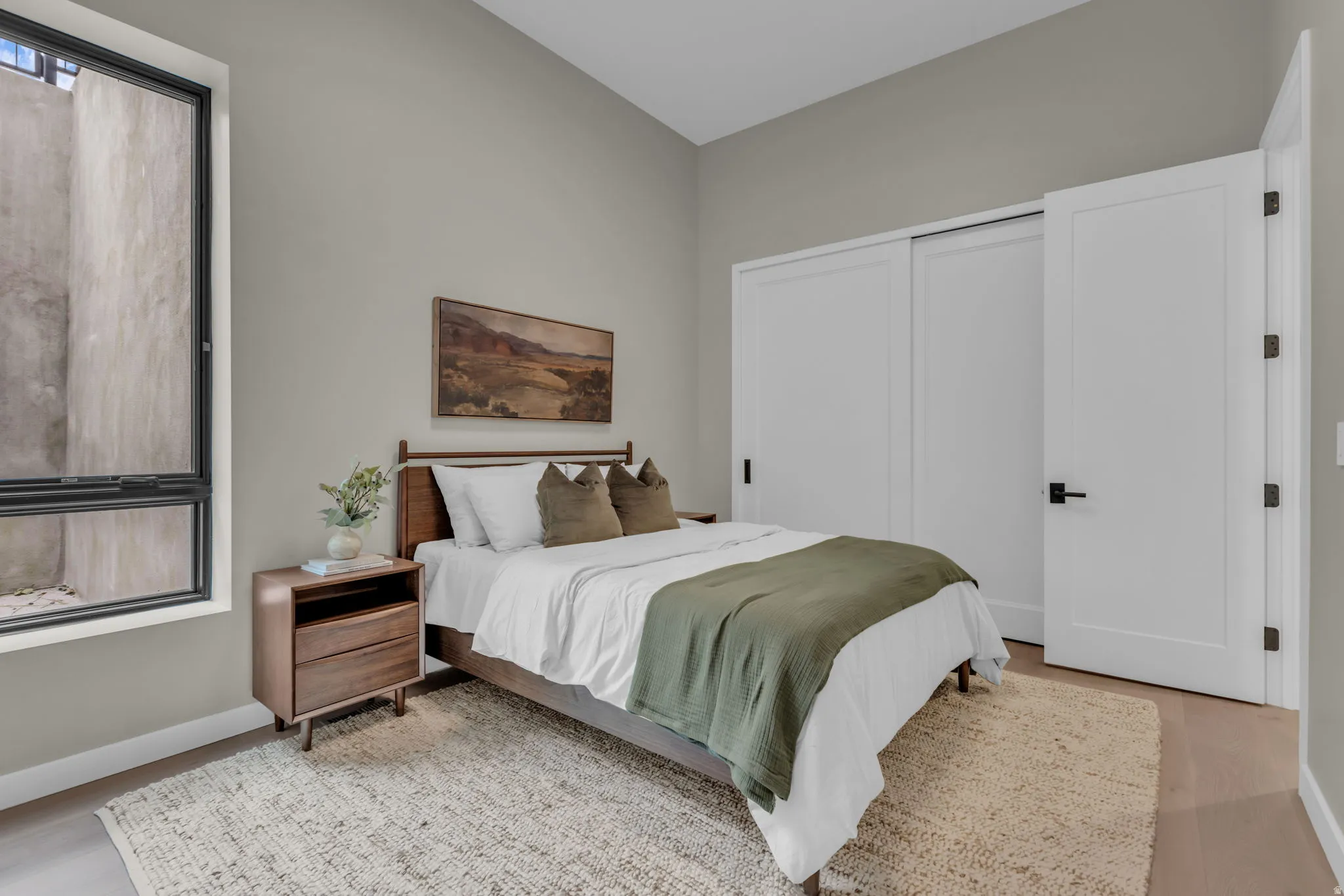 Bedroom featuring a closet and light wood-type flooring