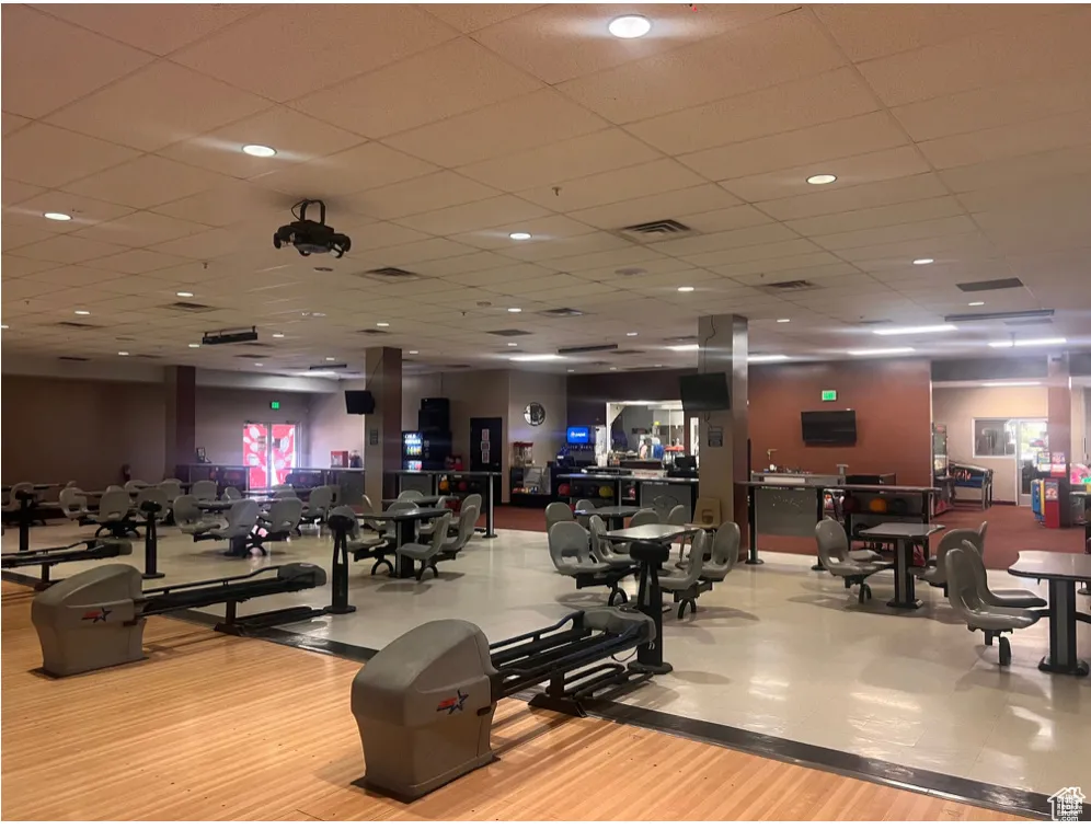Workout area featuring visible vents and wood finished floors