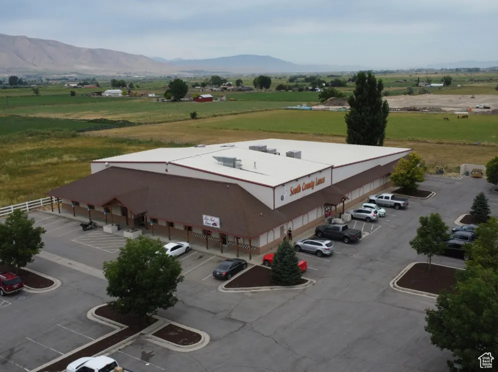 Aerial view featuring a rural view and a mountain view