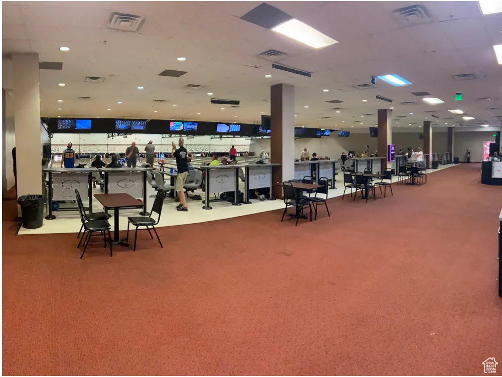 Exercise room featuring visible vents and carpet floors