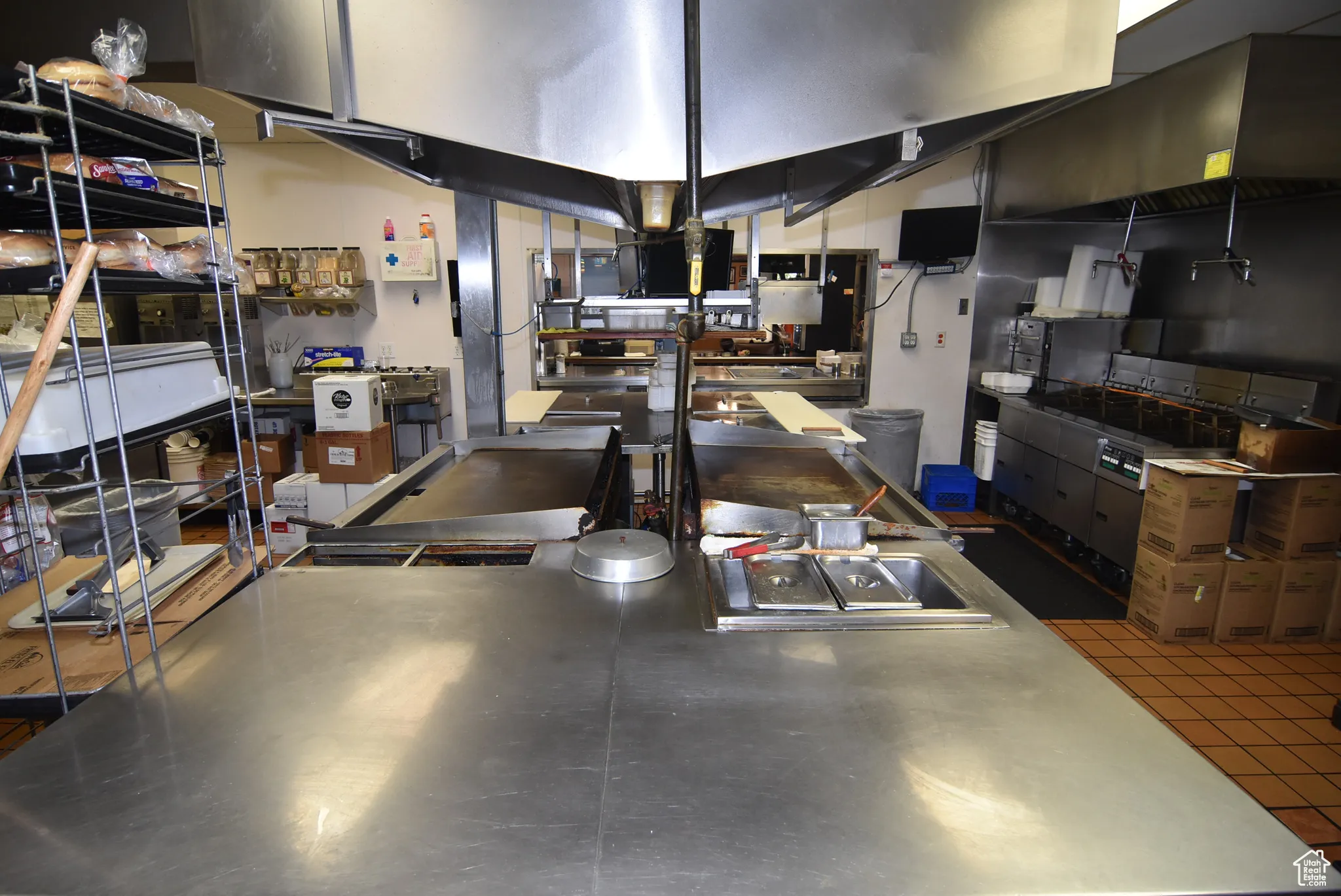 Kitchen featuring stainless steel counter prep area