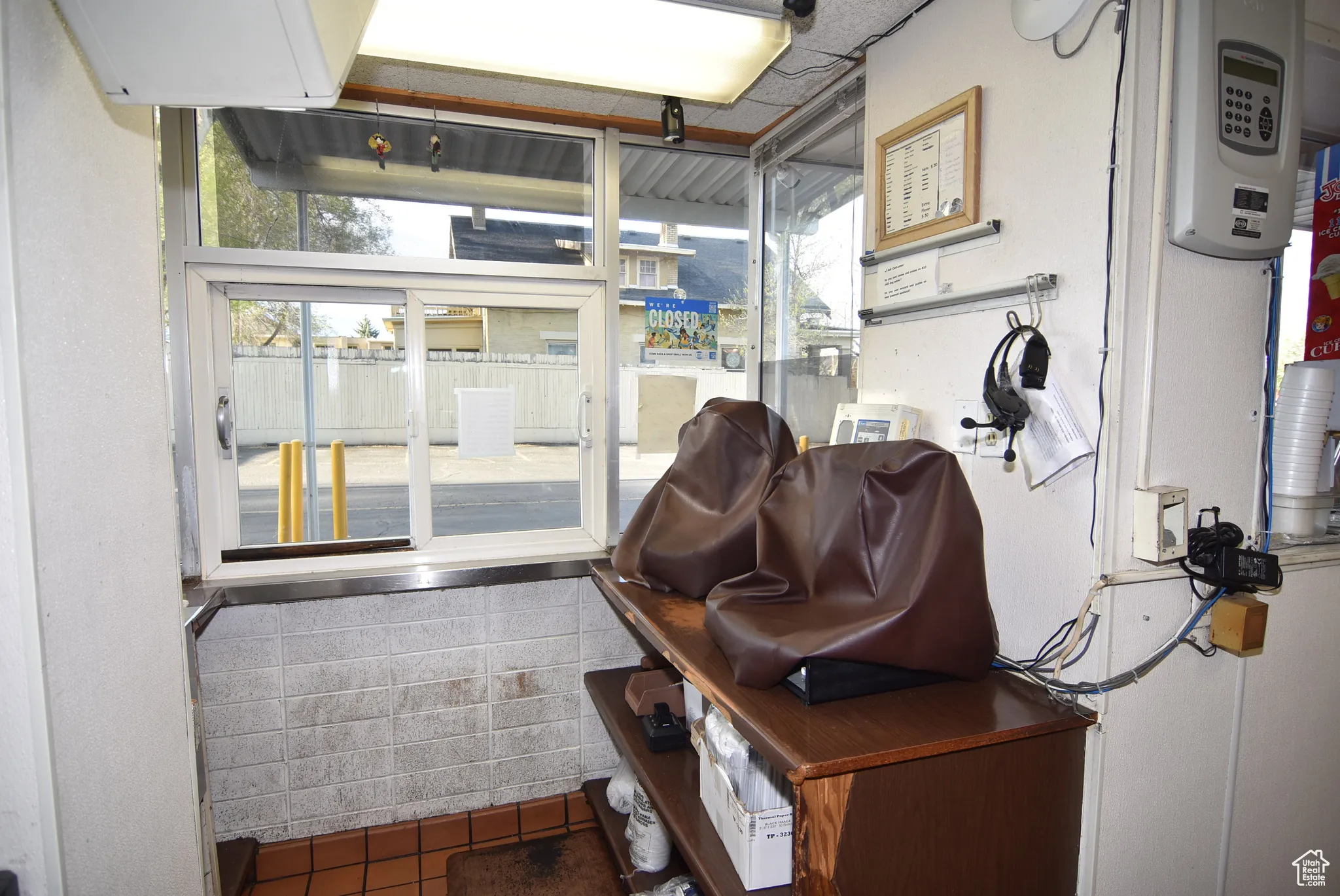 Drive-up window order taking and food delivery area