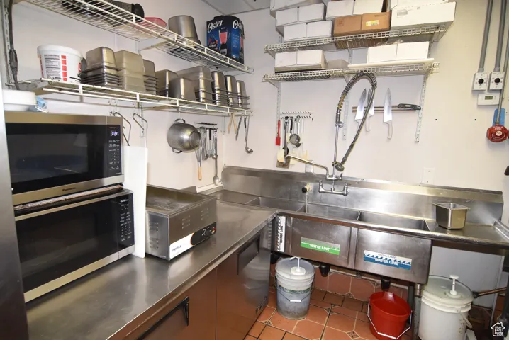 Kitchen with 3-station stainless steel sinks