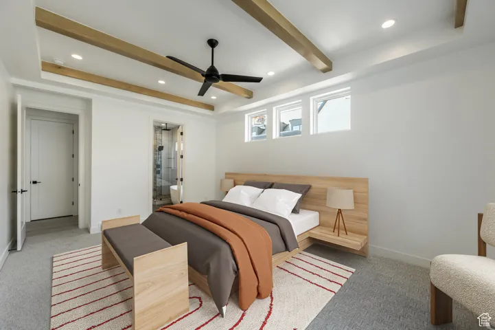 Bedroom with recessed lighting, light colored carpet, beamed ceiling, baseboards, and connected bathroom