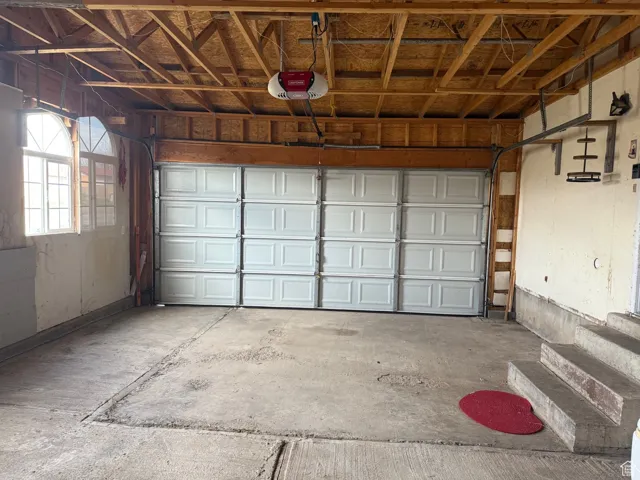 Garage featuring a garage door opener
