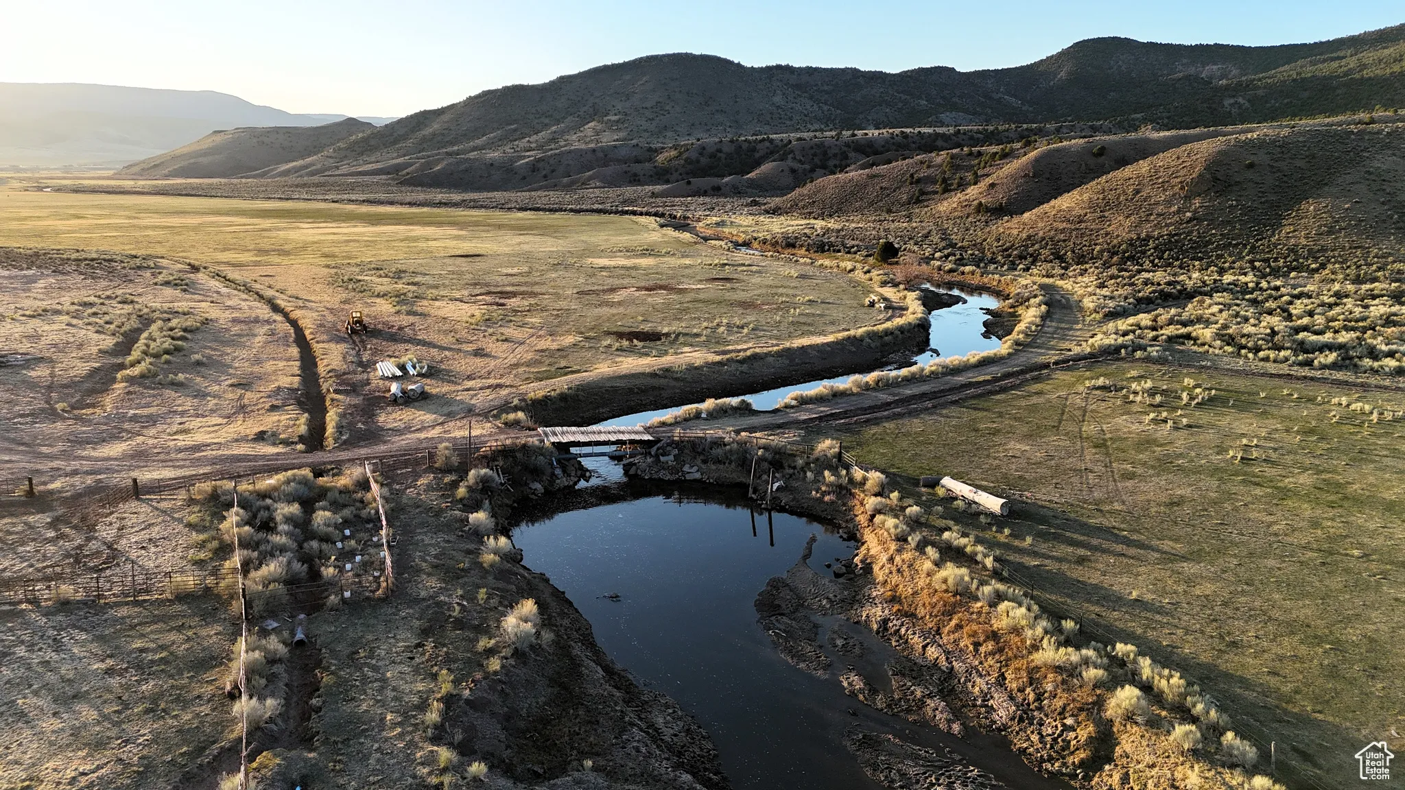 Property view of mountains featuring a rural view and a water view