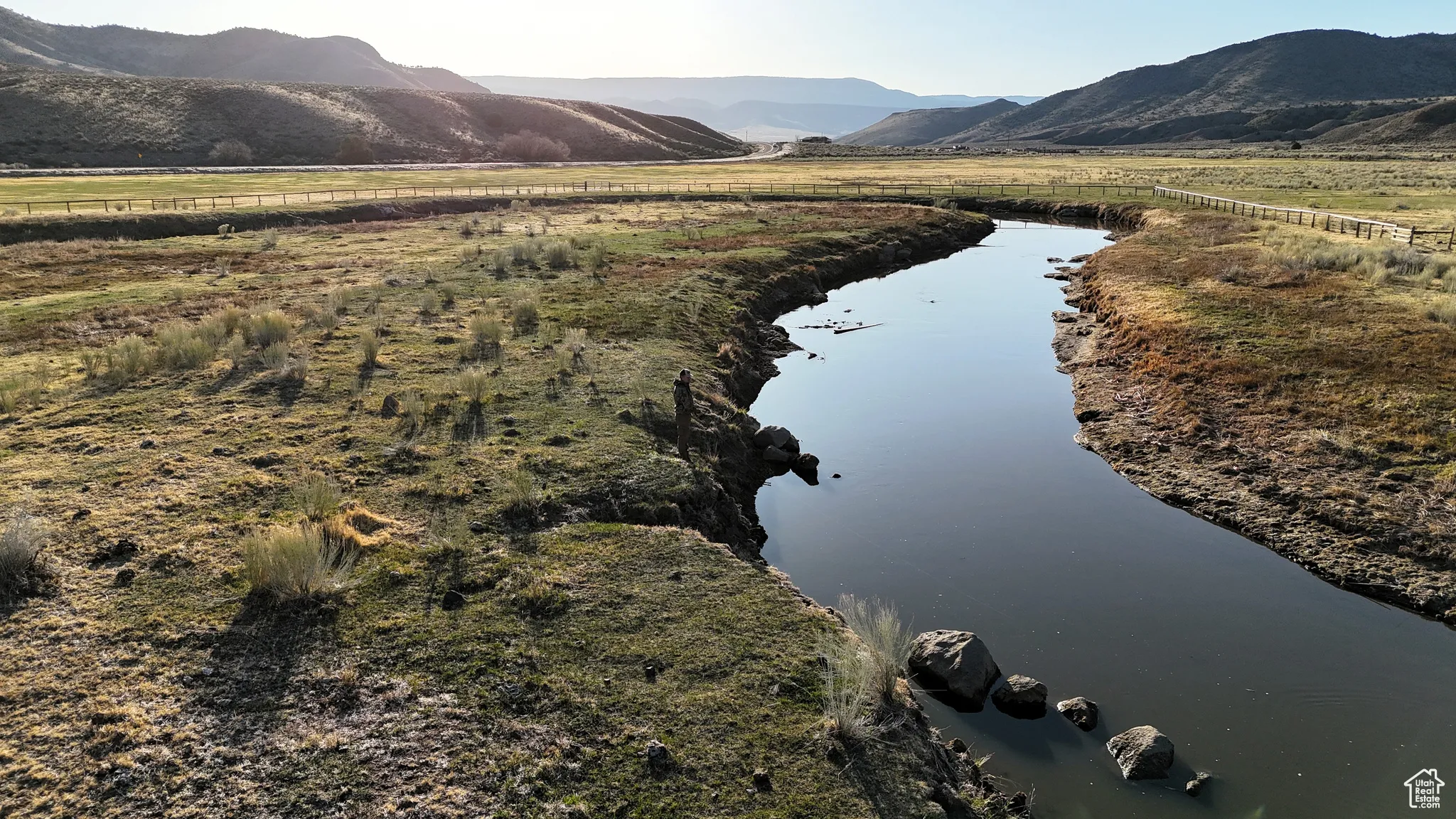 Drone / aerial view with a water and mountain view