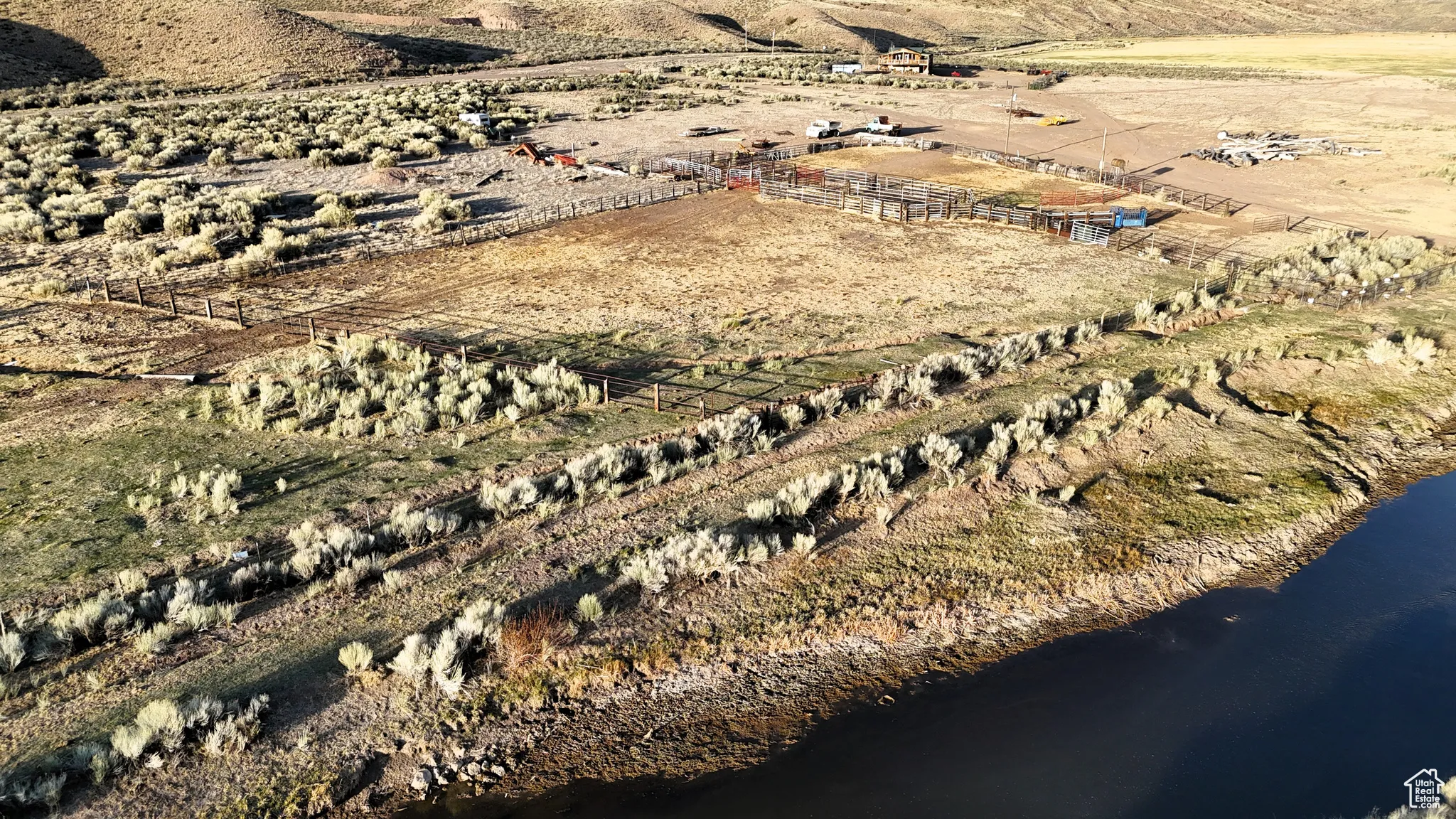 Birds eye view of property featuring a rural view and a water view
