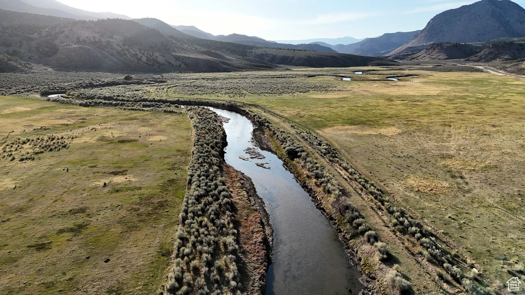 Property view of mountains featuring a water view