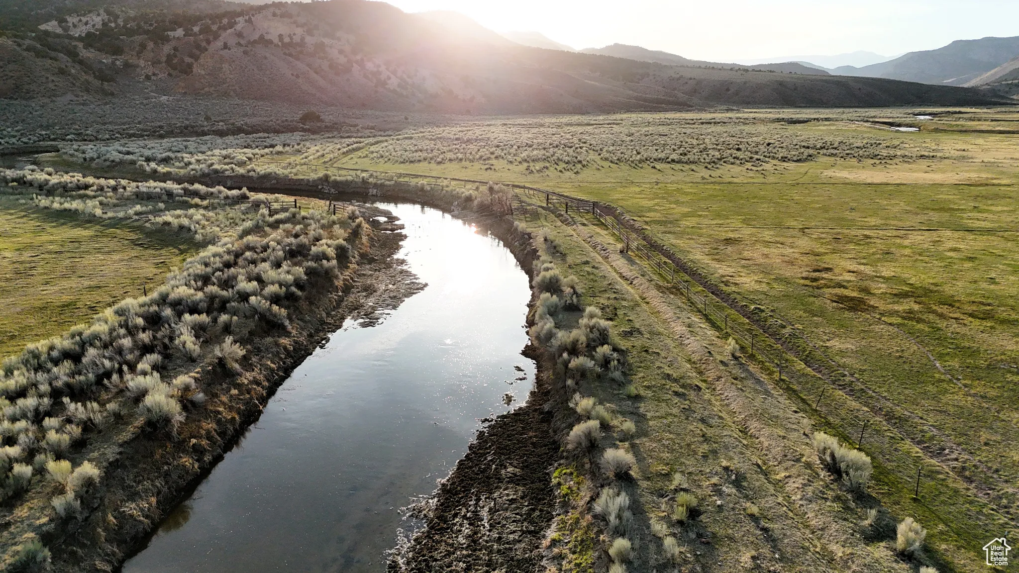 Drone / aerial view with a rural view and a water and mountain view