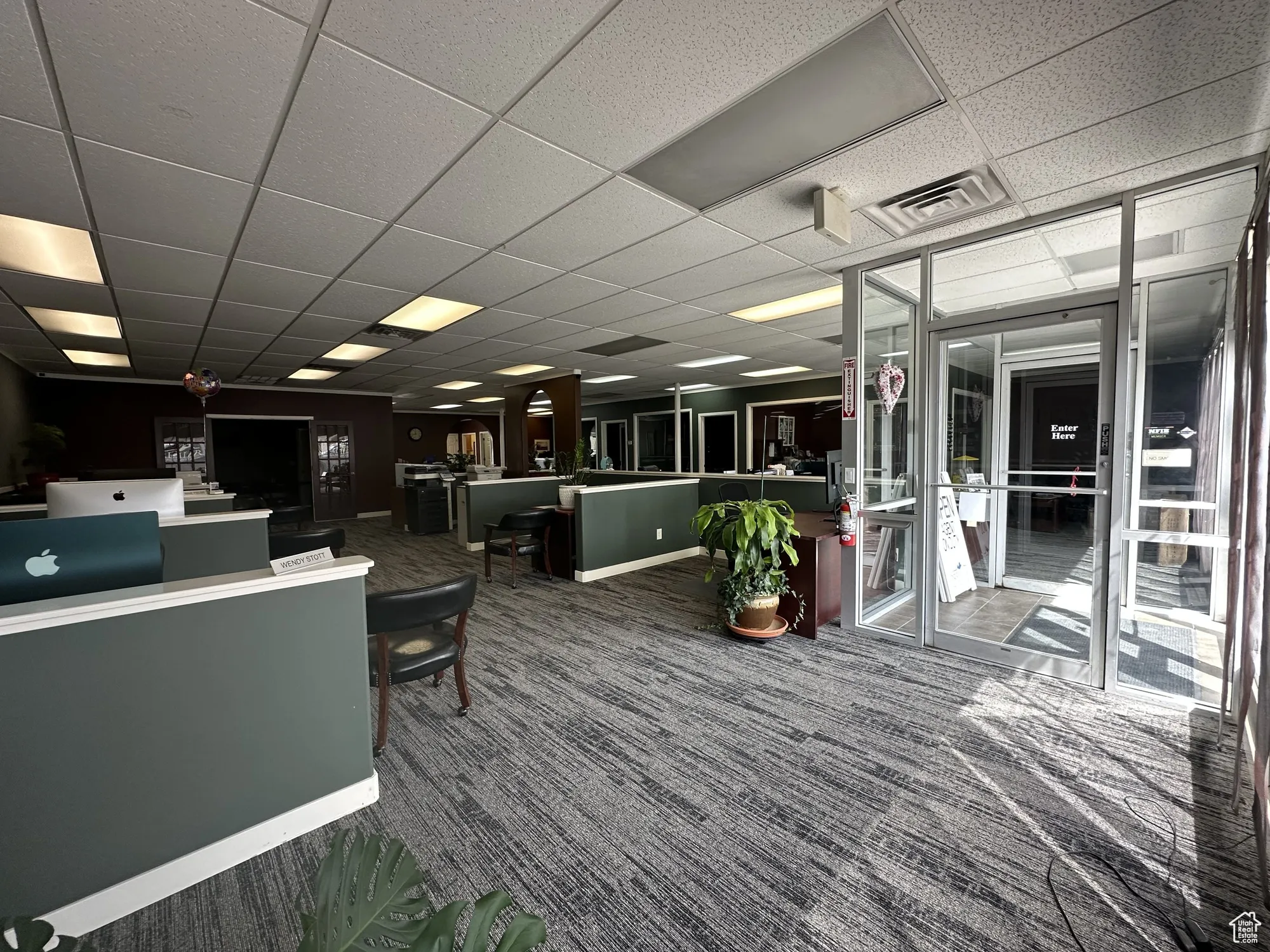 Interior space featuring visible vents and a drop ceiling