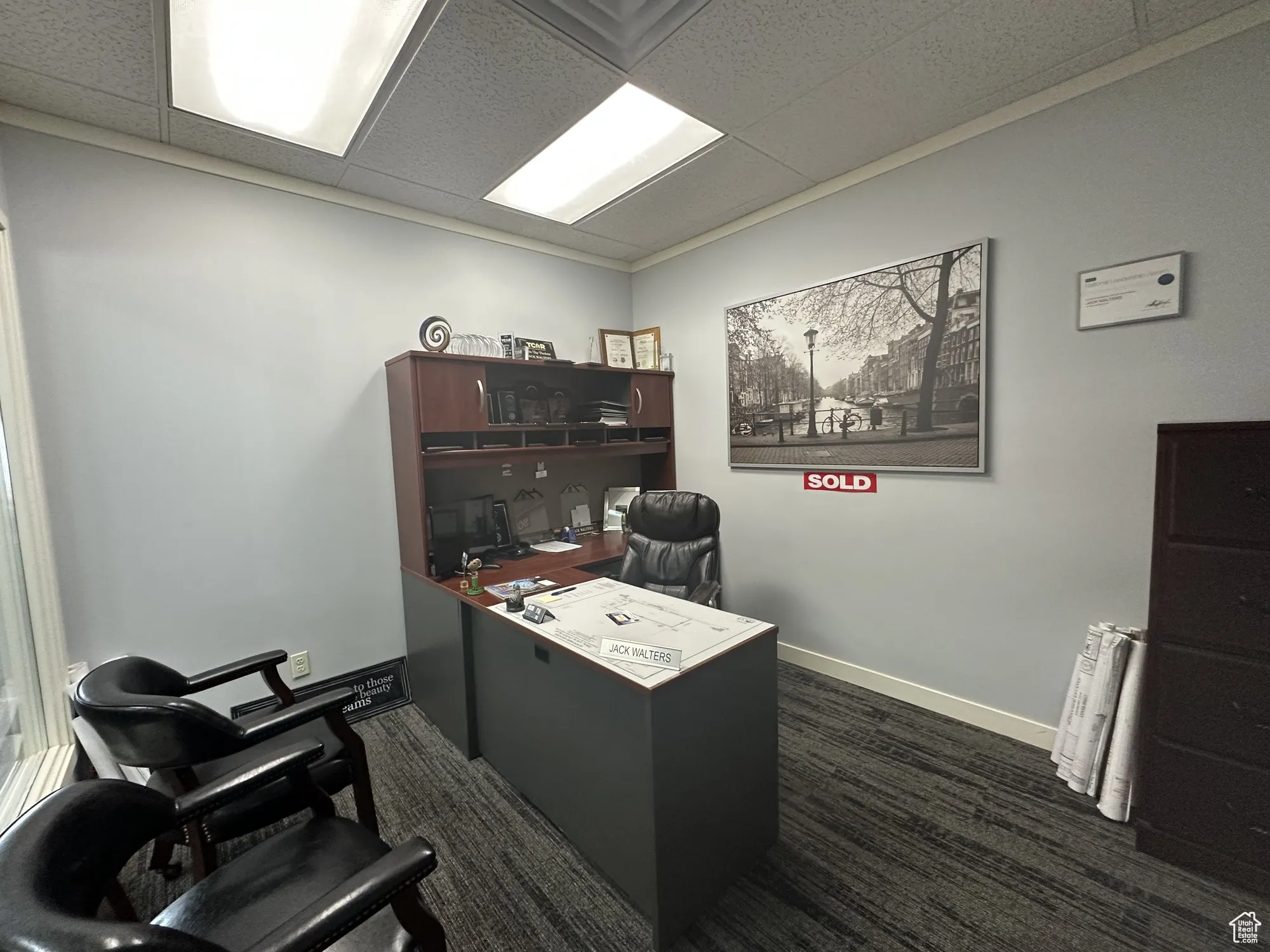 Home office with baseboards and a drop ceiling