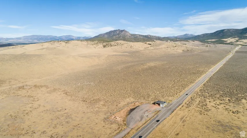 Property view of mountains with view of desert and a rural view