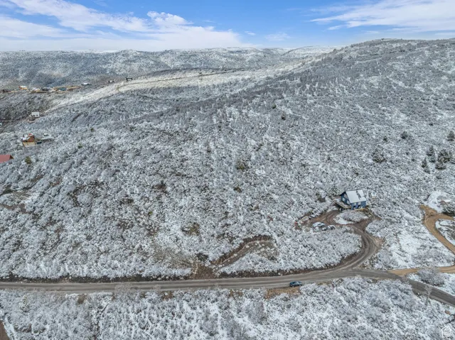 Snowy aerial view with a mountain view