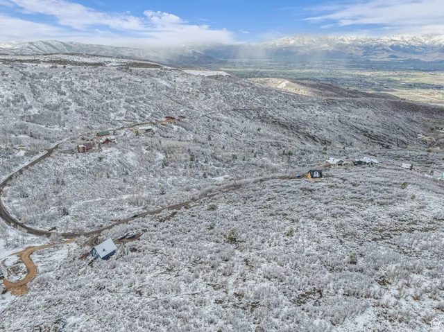 Snowy aerial view with a mountain view
