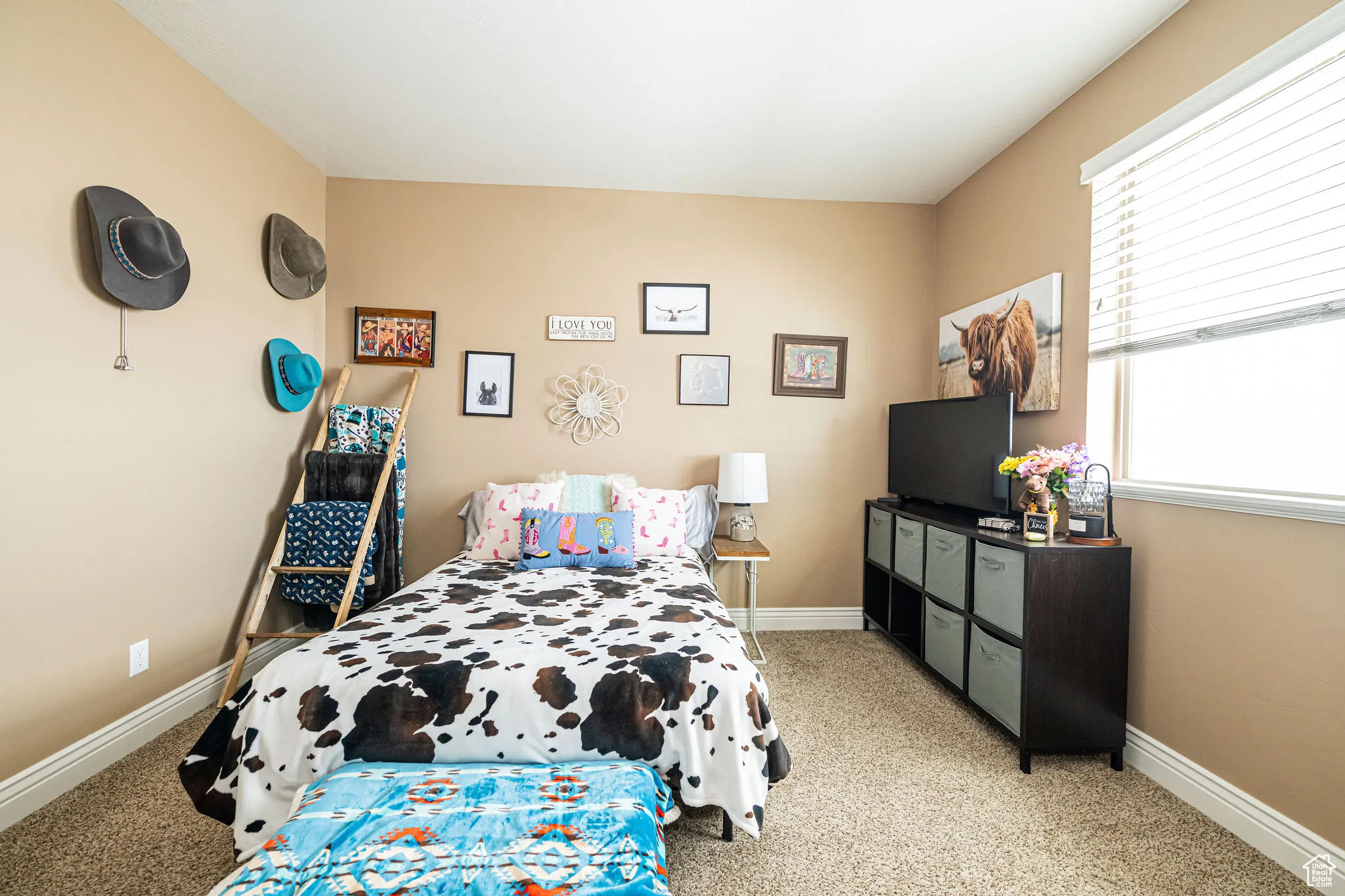 Bedroom featuring baseboards and light colored carpet
