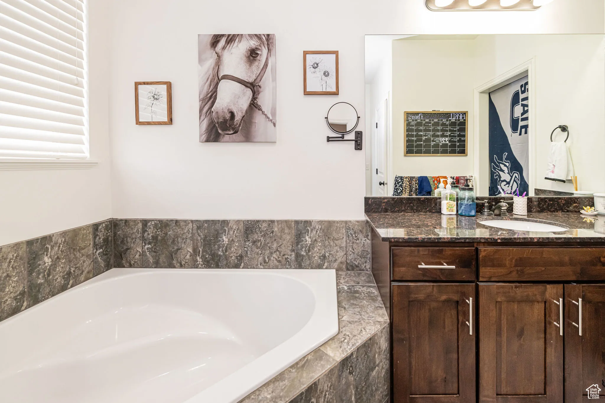 Bathroom with a bath and vanity