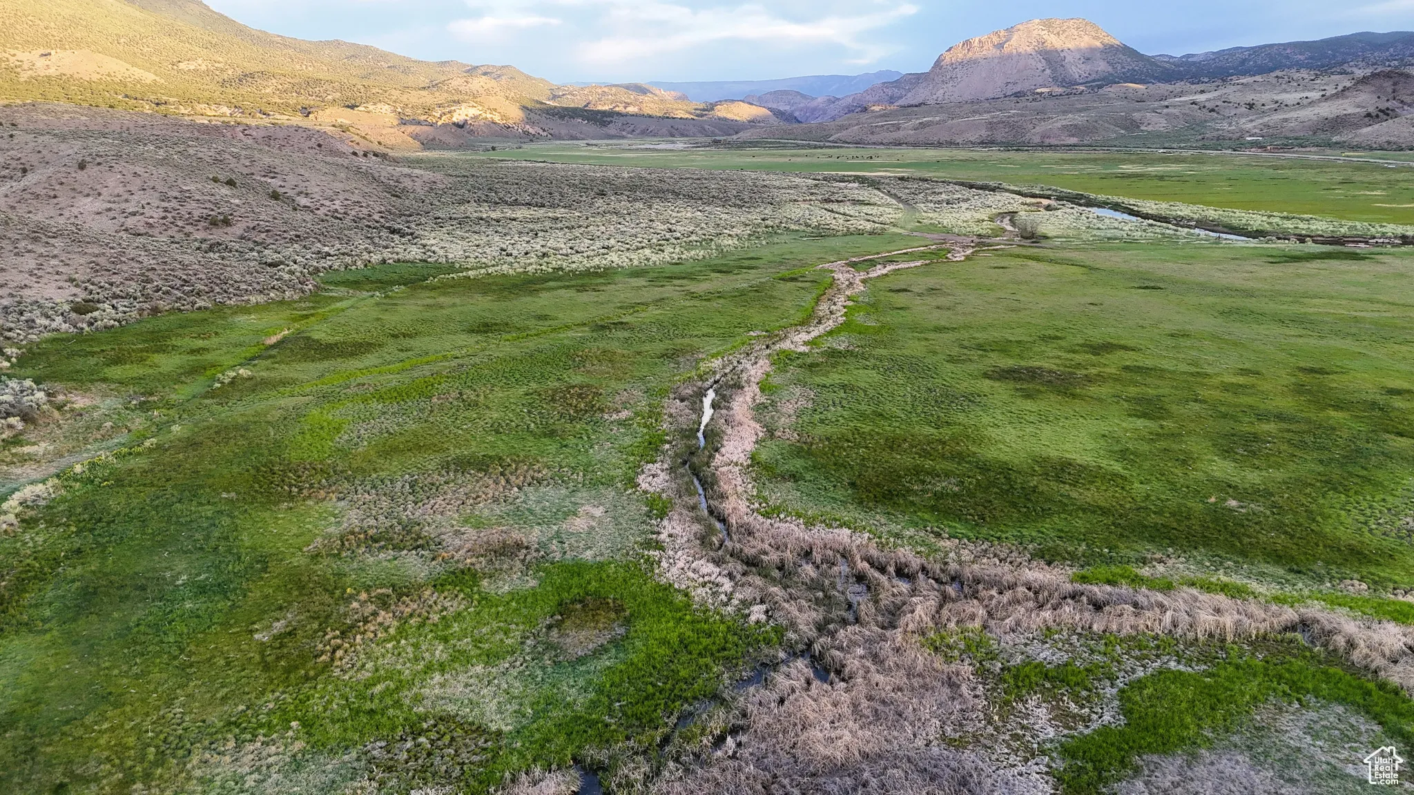 View of mountain backdrop with rural landscape