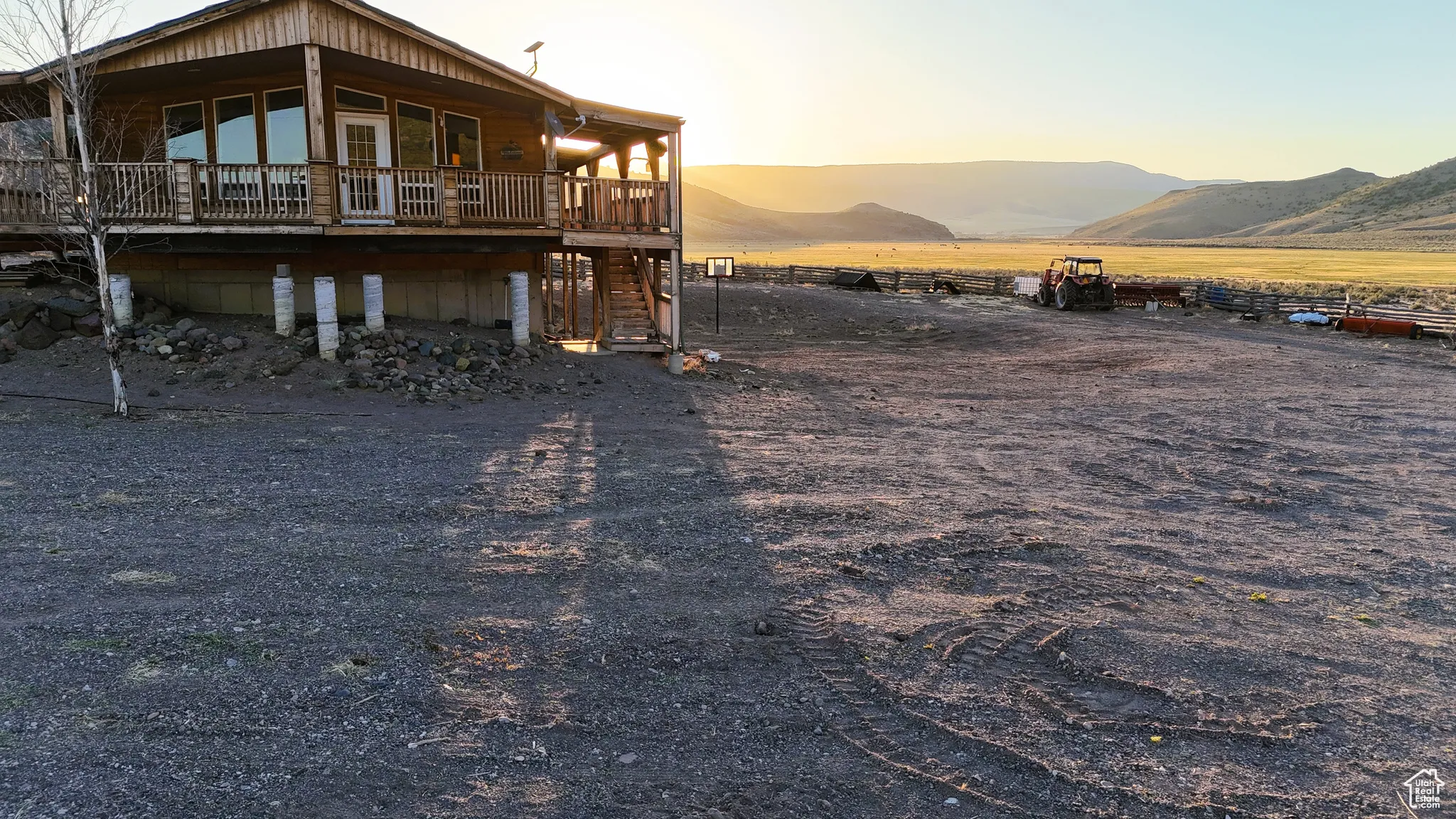 Rear view of property featuring a mountain view and stairs