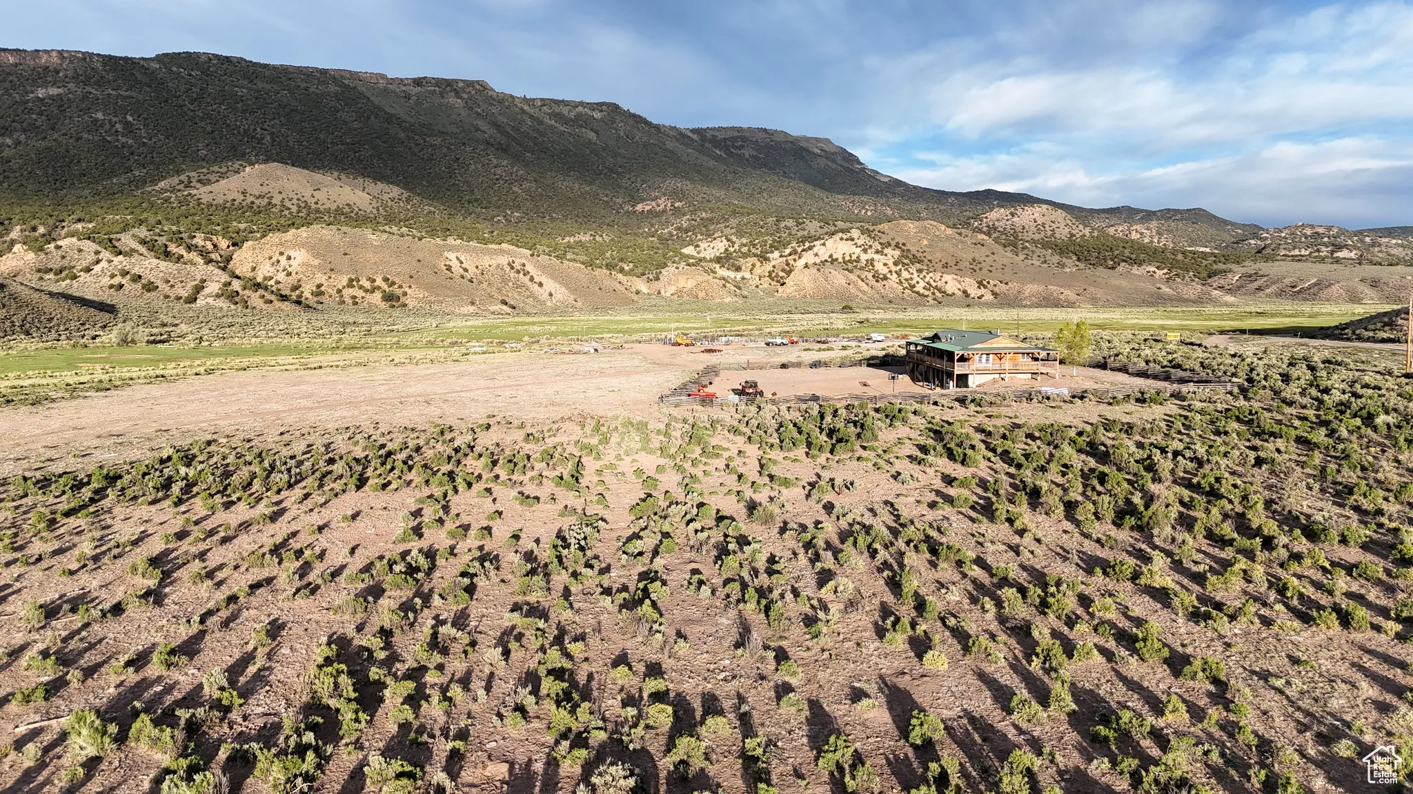 View of mountain backdrop featuring rural landscape