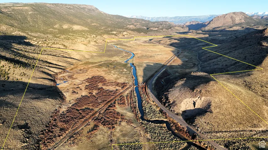 View of mountain backdrop with rural landscape