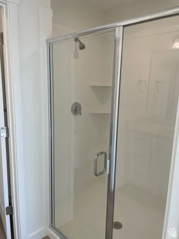 Bathroom featuring a shower stall