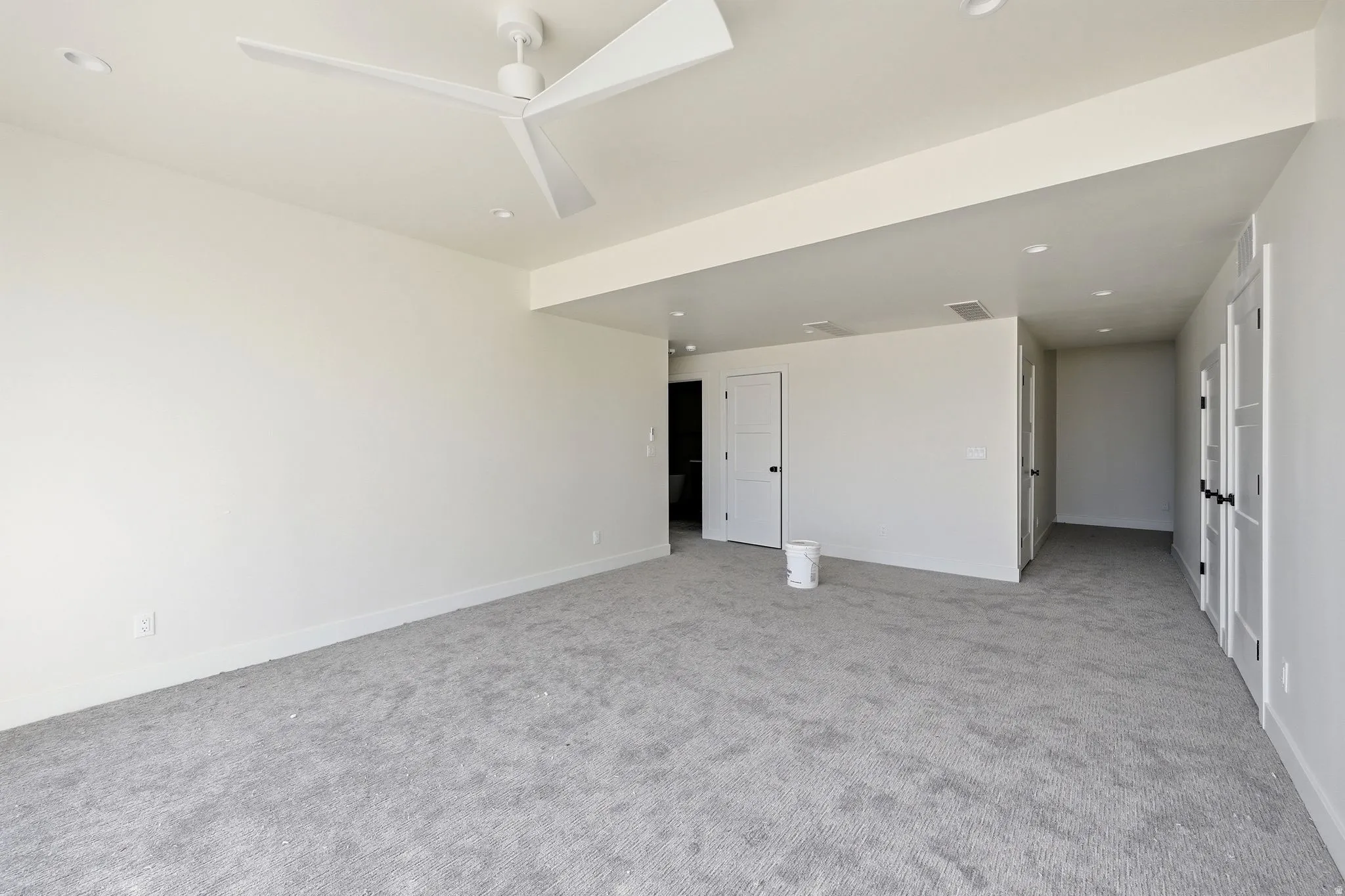 Empty room featuring light colored carpet, recessed lighting, and ceiling fan