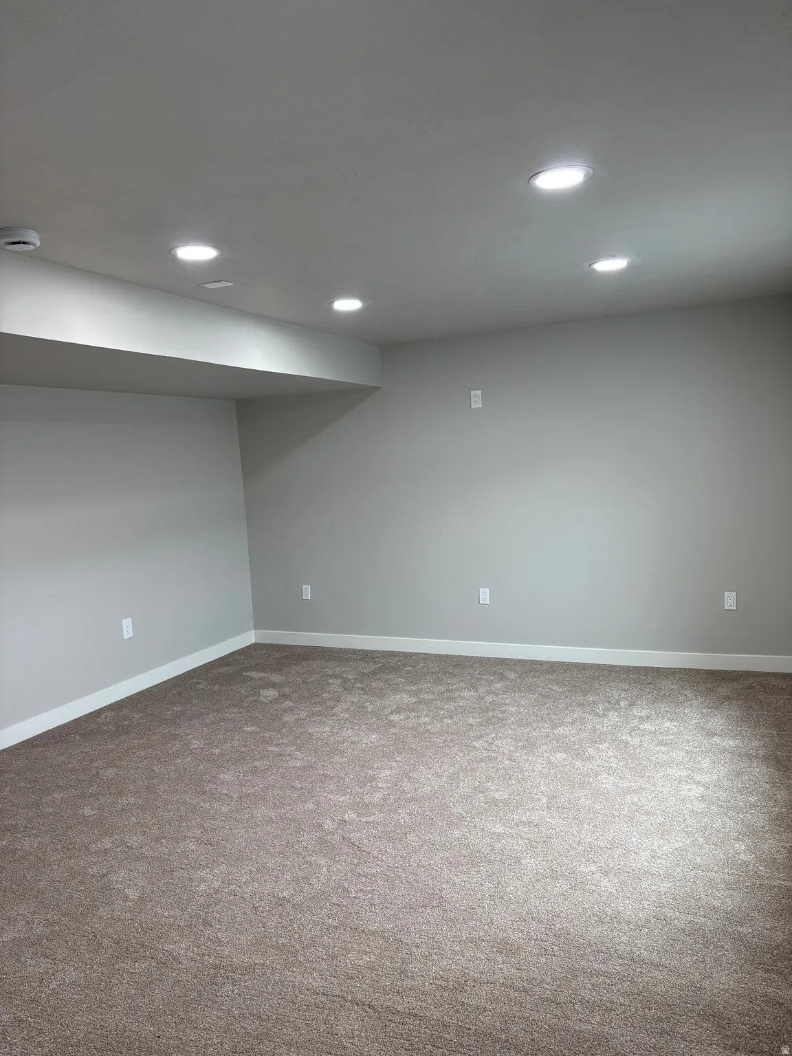 Finished basement featuring carpet flooring and recessed lighting